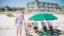 man & woman on beach chairs