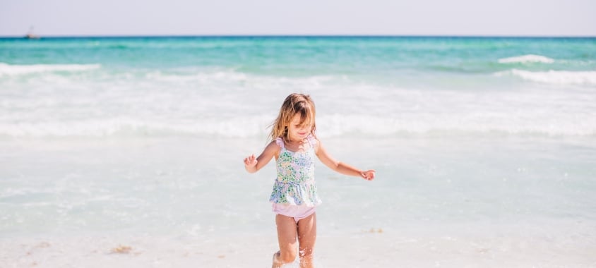 Girl splashing in surf