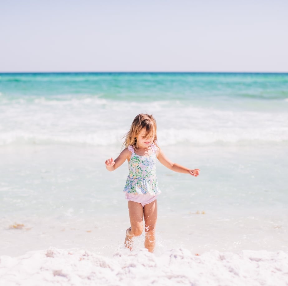 Girl splashing in surf